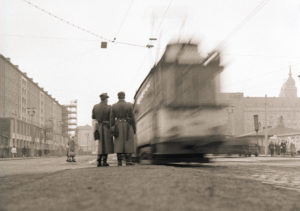 Two People's Police officers watch the morning traffic on Prager Strasse in Dresden Two People's Police officers watch the morning traffic on Prager Strasse in Dresden